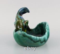 Belgian studio ceramicist. Bowl in glazed ceramics modelled with fish