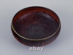 Carl Harry Stålhane for Rörstrand. Ceramic bowl with glaze in brown tones