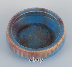 Gunnar Nylund for Rörstrand. Ceramic bowl with glaze in blue and brown tones