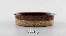 Helle Alpass (1932-2000). Low bowl of raw and glazed stoneware in brown shades