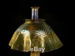 L. C. T. Studio oil lamp with favrile, pulled feather and king tut patterns. All o