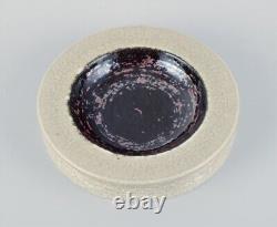 Rörstrand, Sweden, ceramic bowl in cream and black metallic glaze